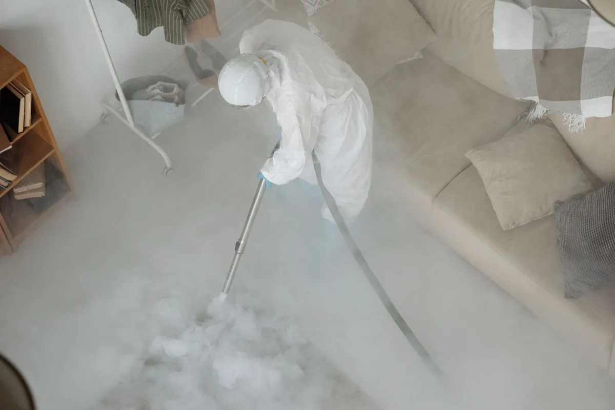 Biohazard cleanup technician in protective equipment, Fort Hunter Liggett, CA